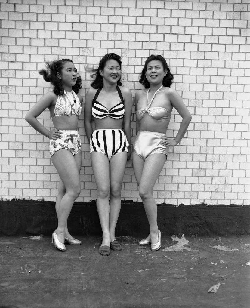 Three dancing girls at the Imperial Theater in Tokyo on May 29, 1946, model new 1946 style Japanese bathing suits, known as ÂDemocratic suits.